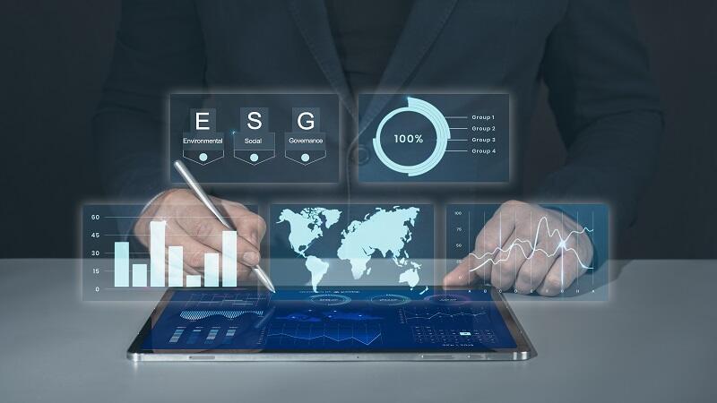 Businessman using tablet for analysis ESG environmental social governance business strategy investing concept.