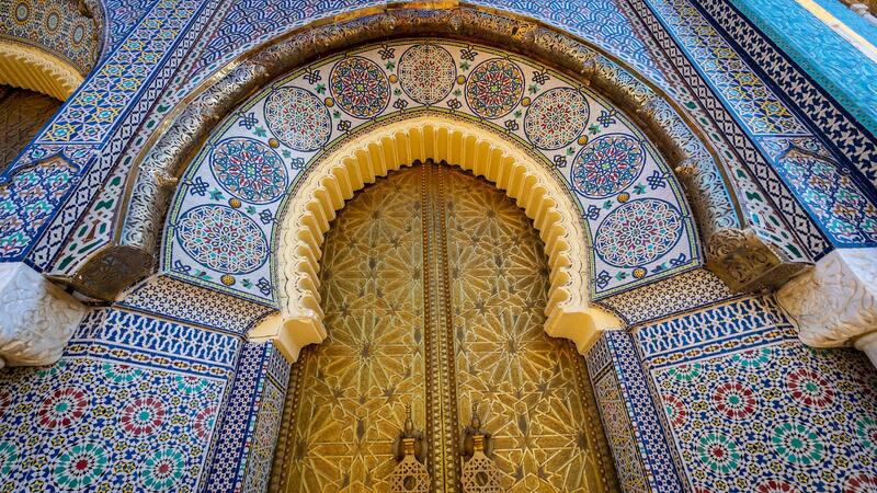 Upright view at the golden palace door with ornamental decorations in Fes, Morocco