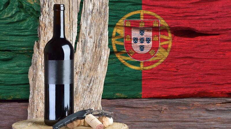 bottle of wine with Portugal flag in the background