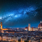 Milky way and falling stars over Florence at night, Italy